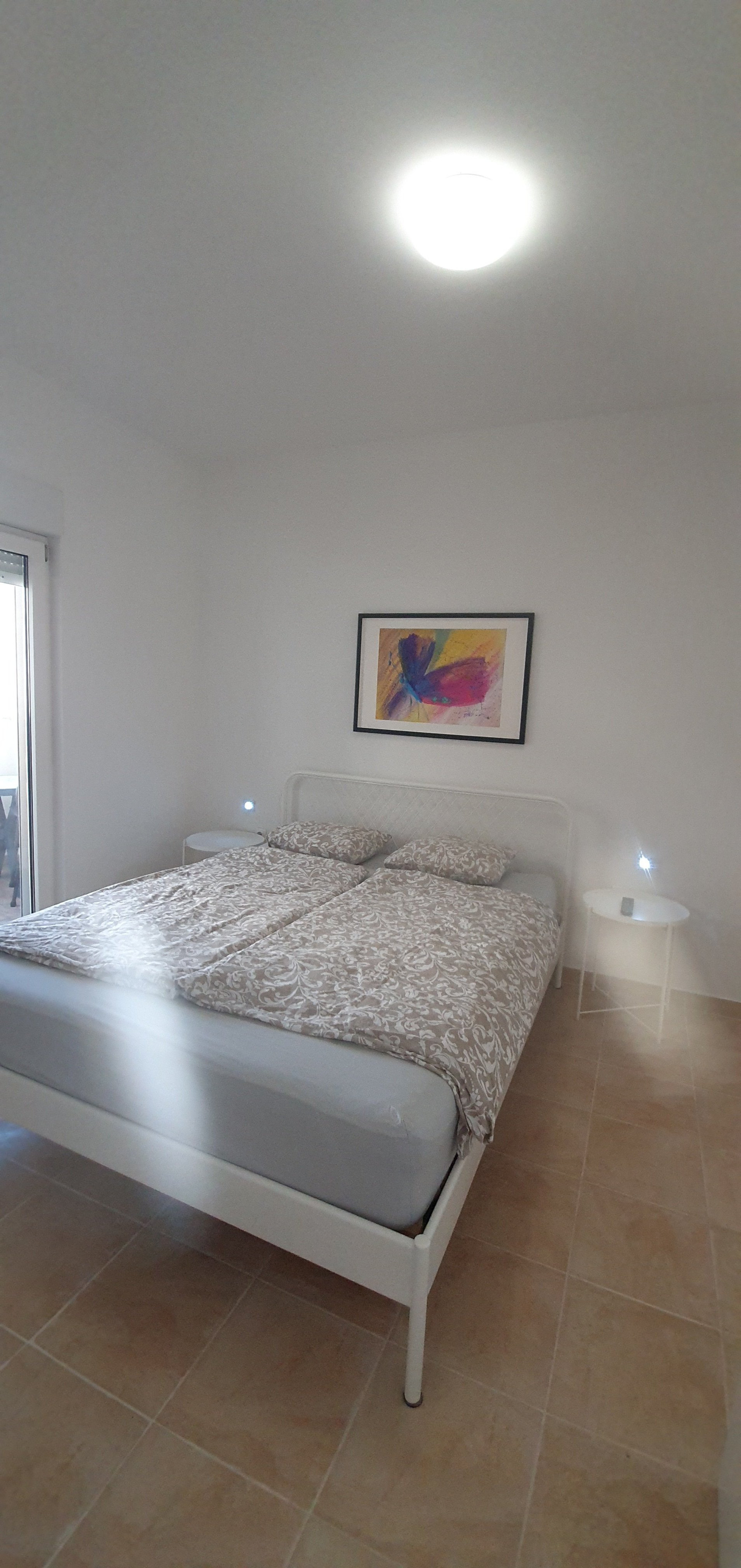 Bright bedroom with double bed