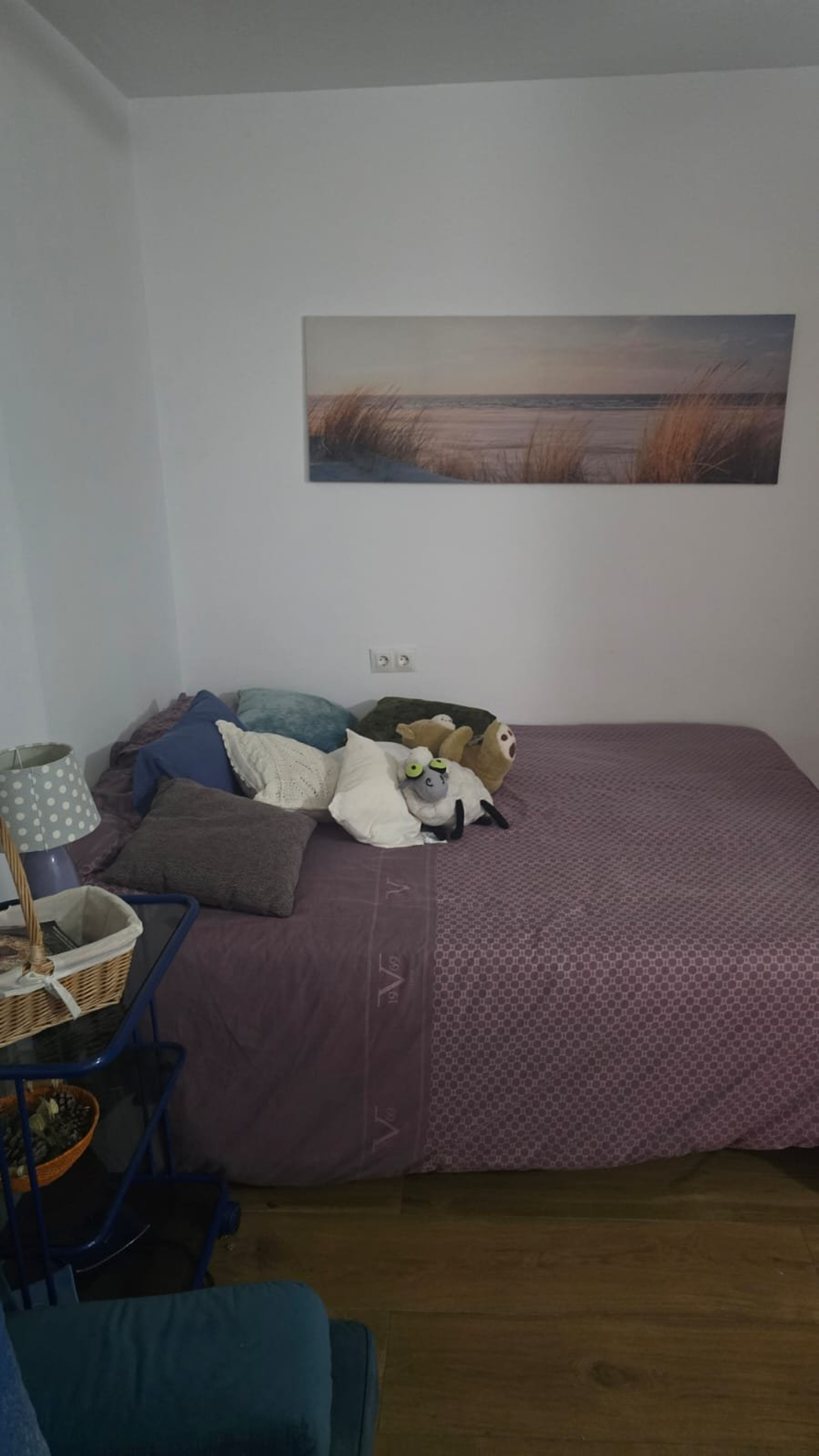 Double bed with beach wall art