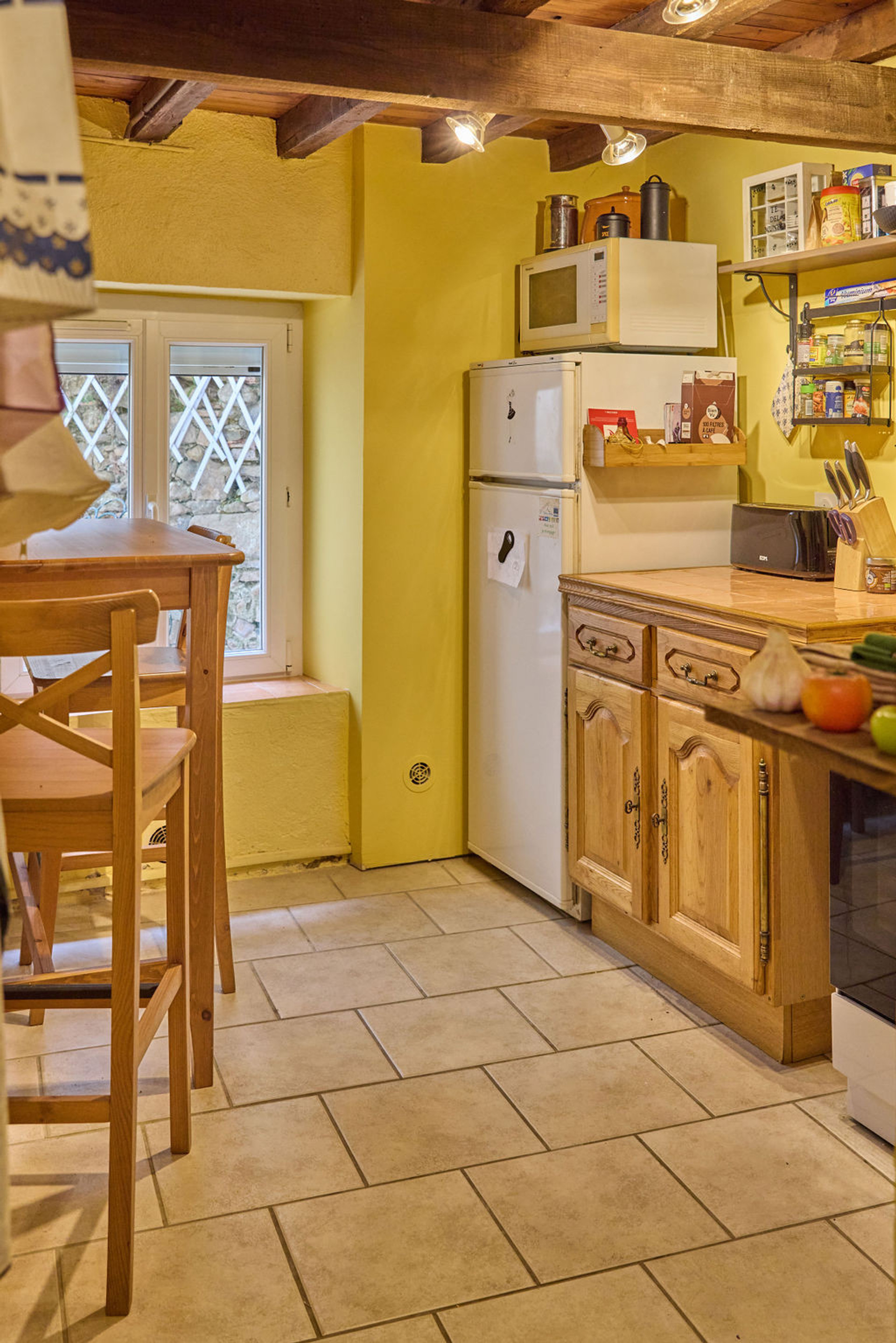 The kitchen is divided in two different spaces and is fully equipped
