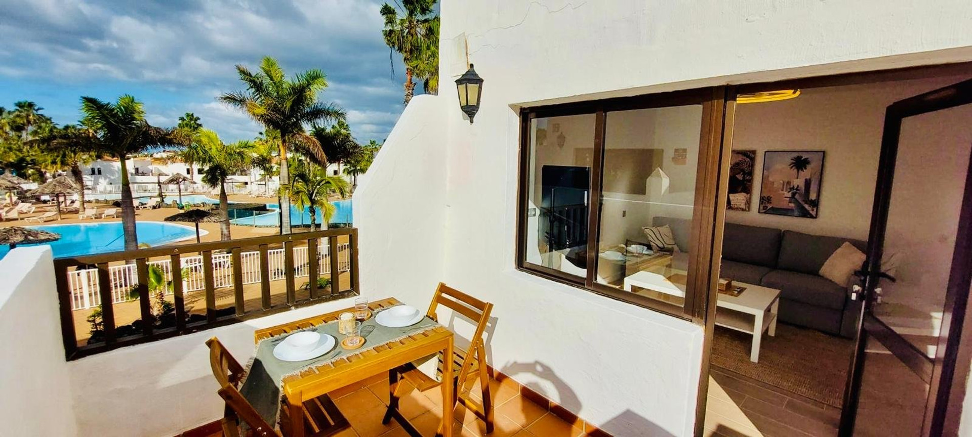 Balcony dining with pool view