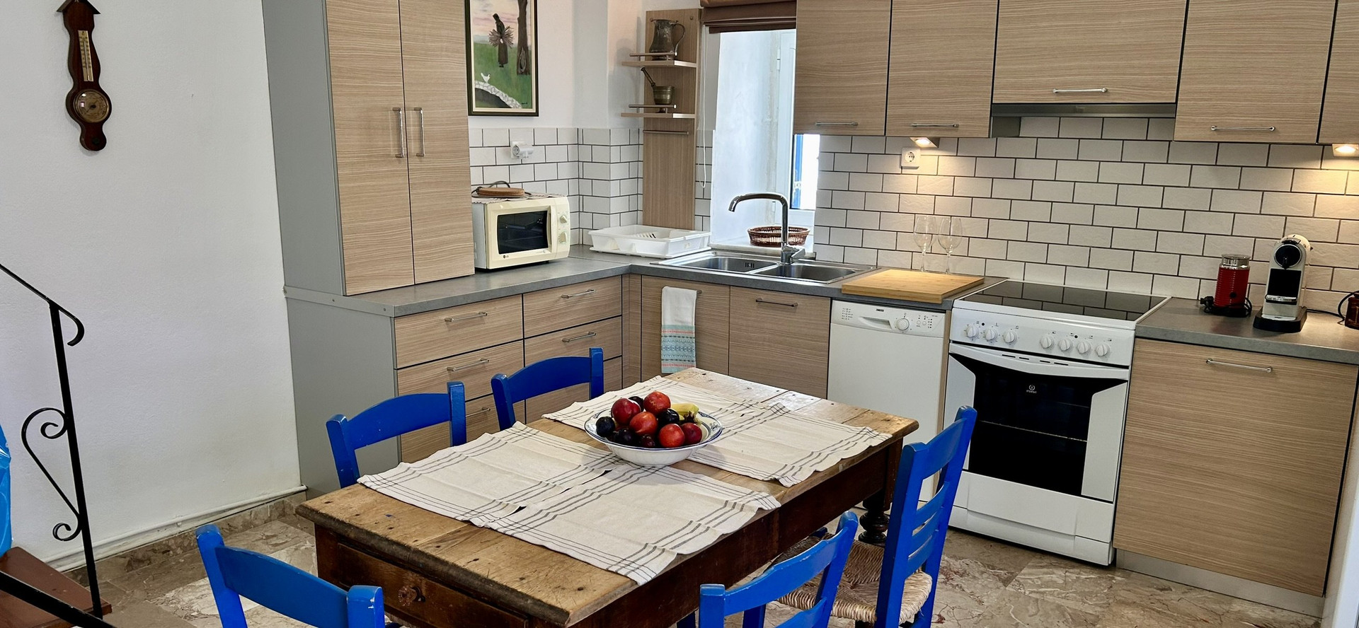 Kitchen with blue chairs