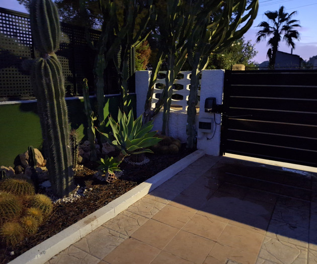 Cactus garden gate at dusk