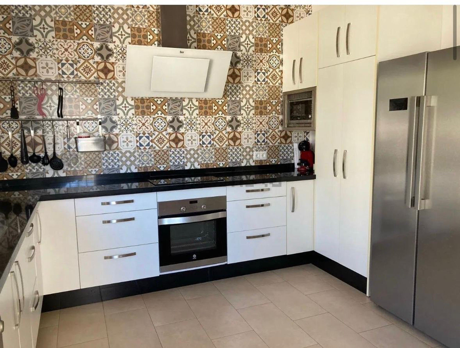 Kitchen with fridge and oven