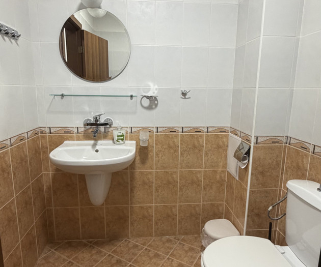 Bathroom with sink and toilet