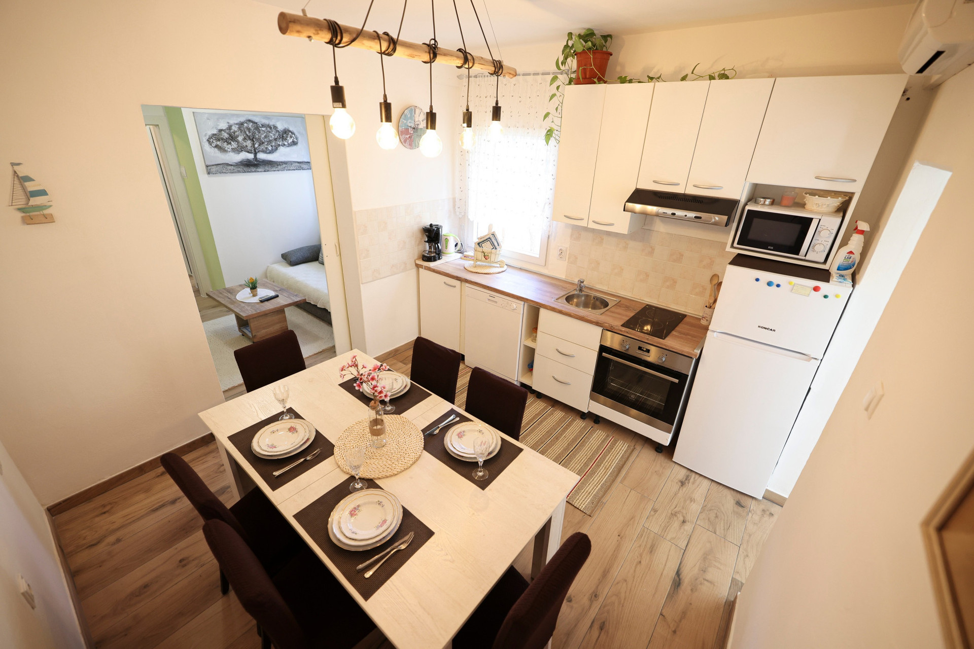 a fully equipped kitchen with a dining room
