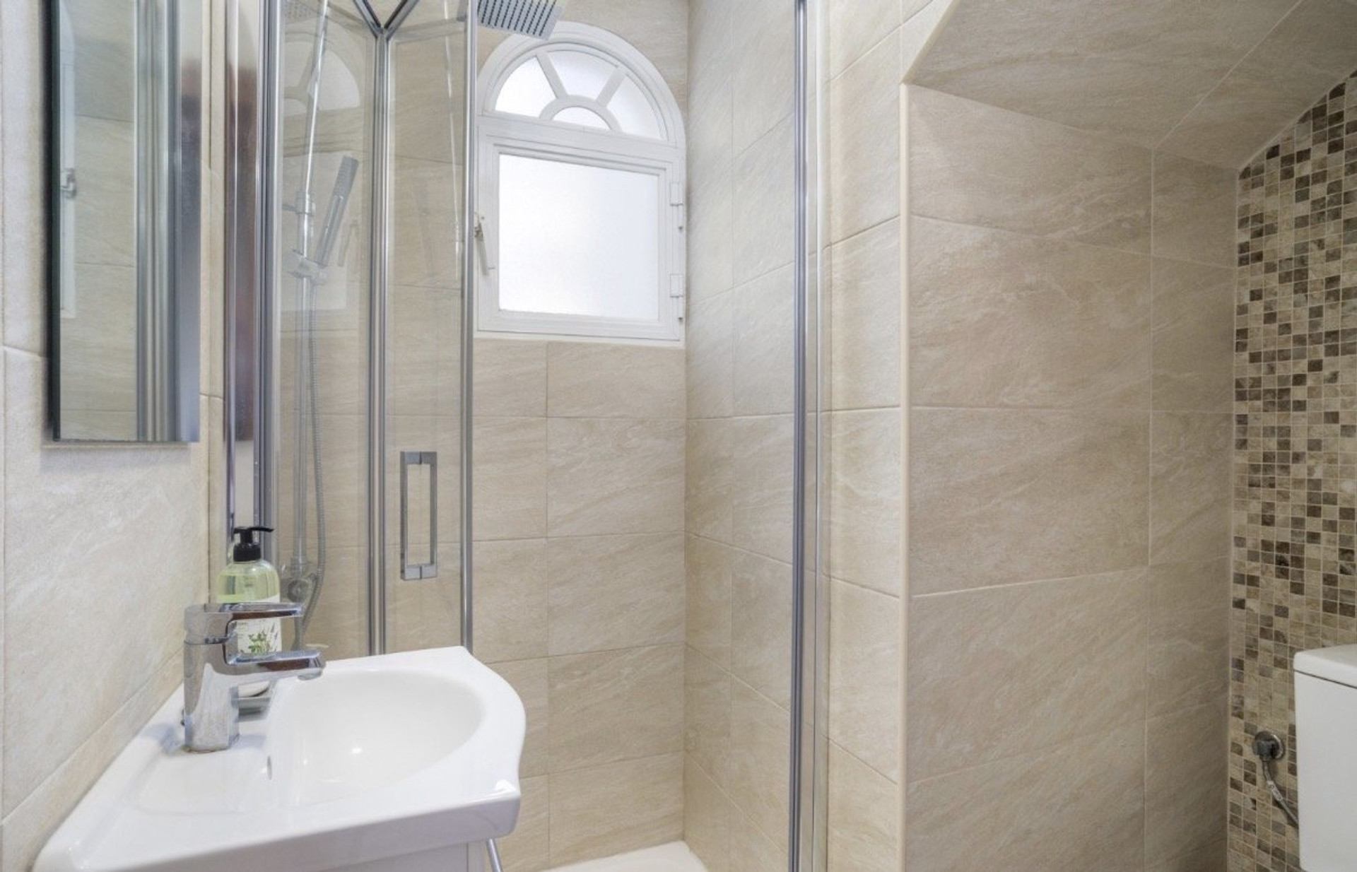 Bathroom with shower and window
