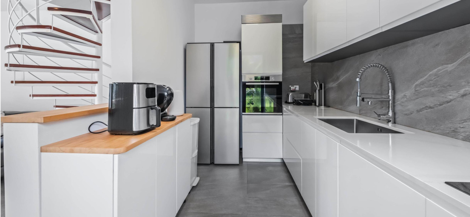 Modern white kitchen with appliances