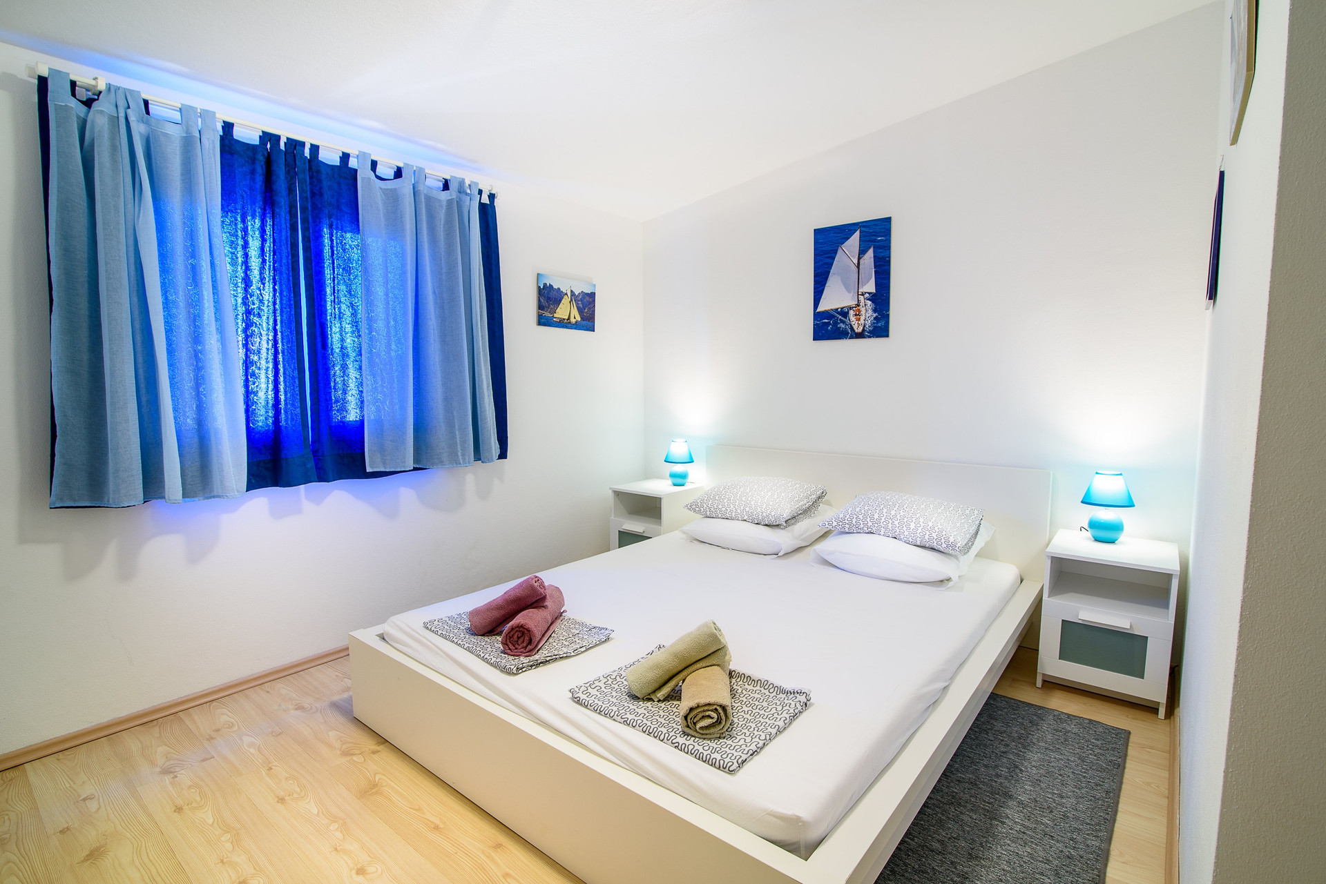 Double bed with blue lighting