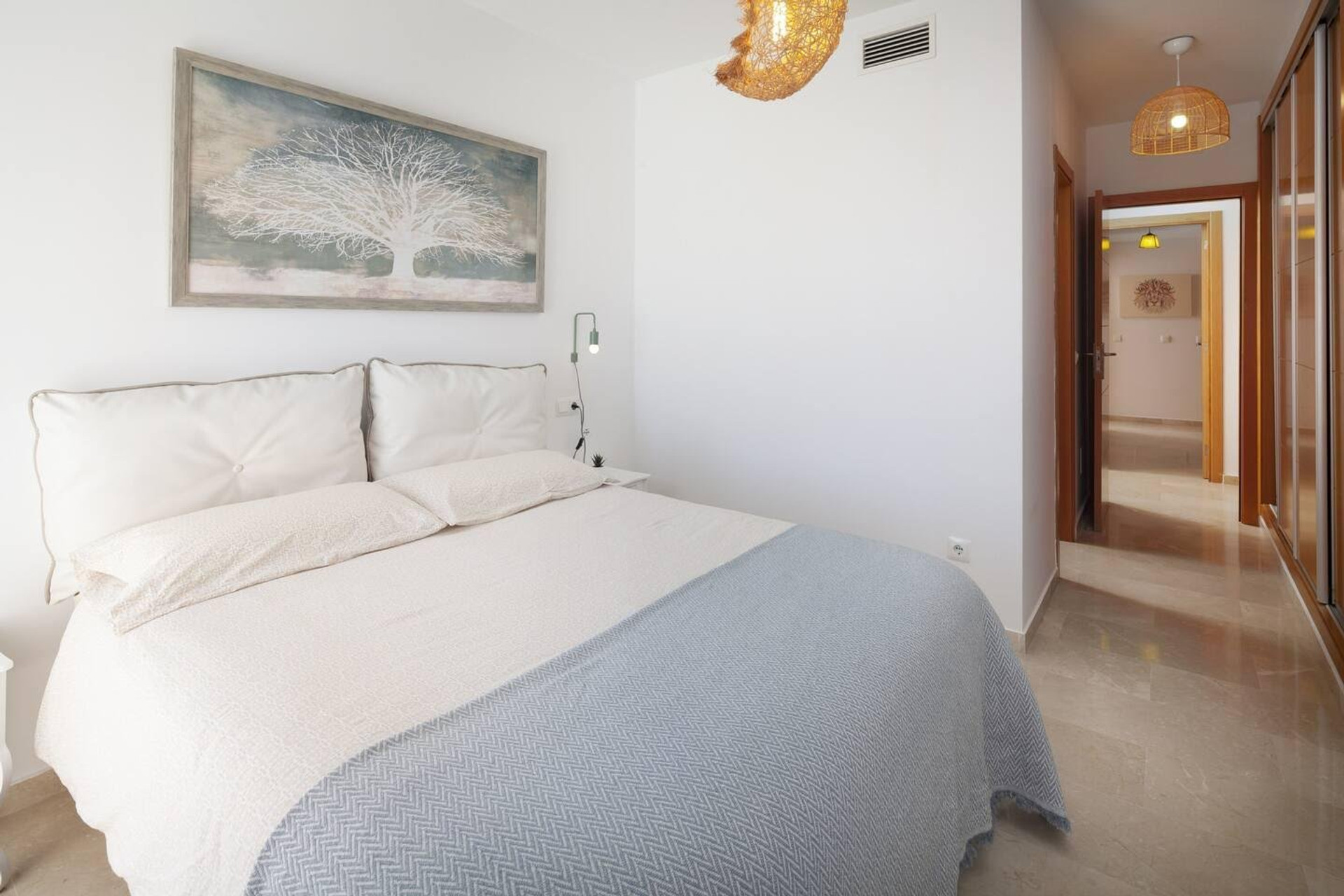 Bright bedroom with hallway view