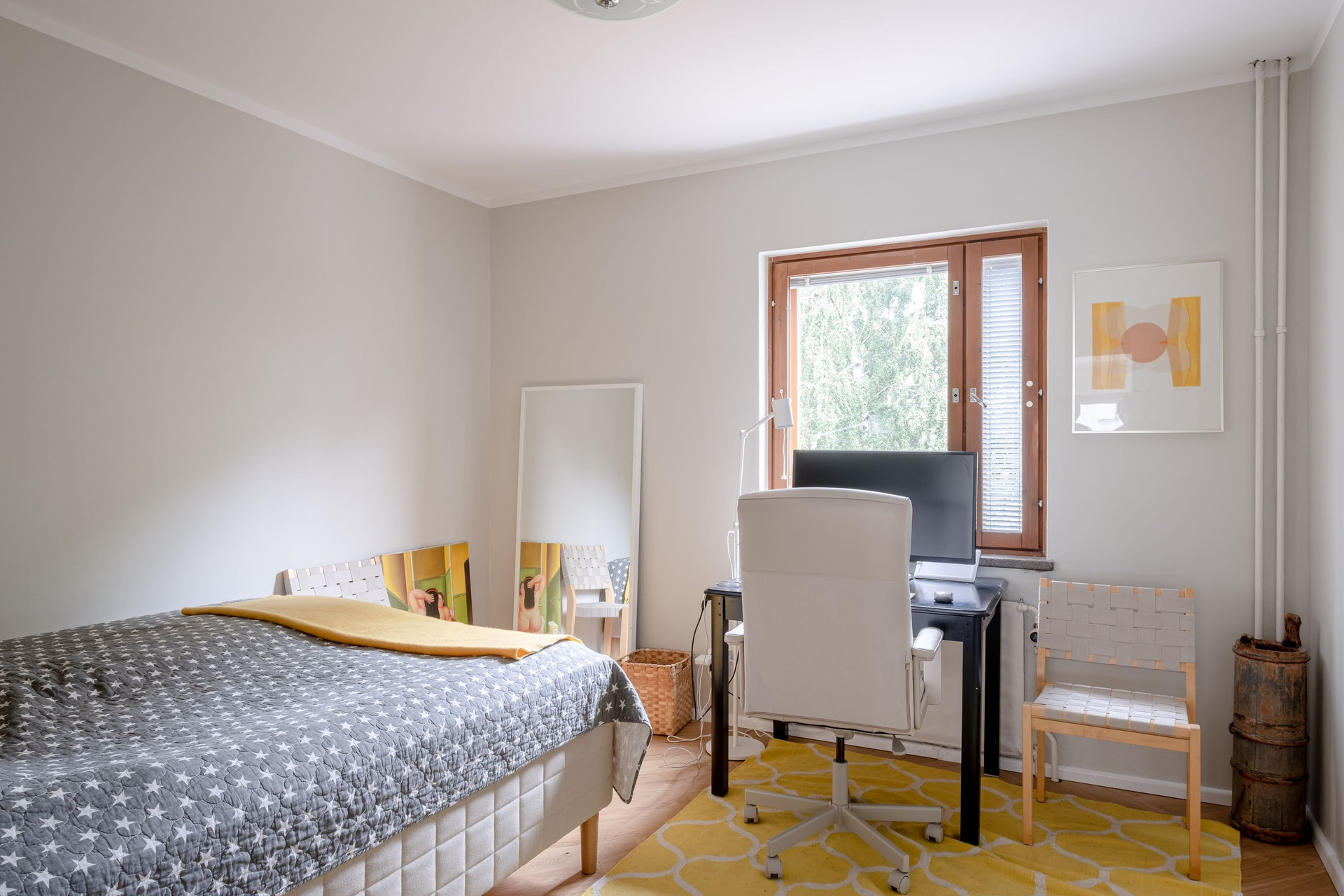 Bedroom with desk and window
