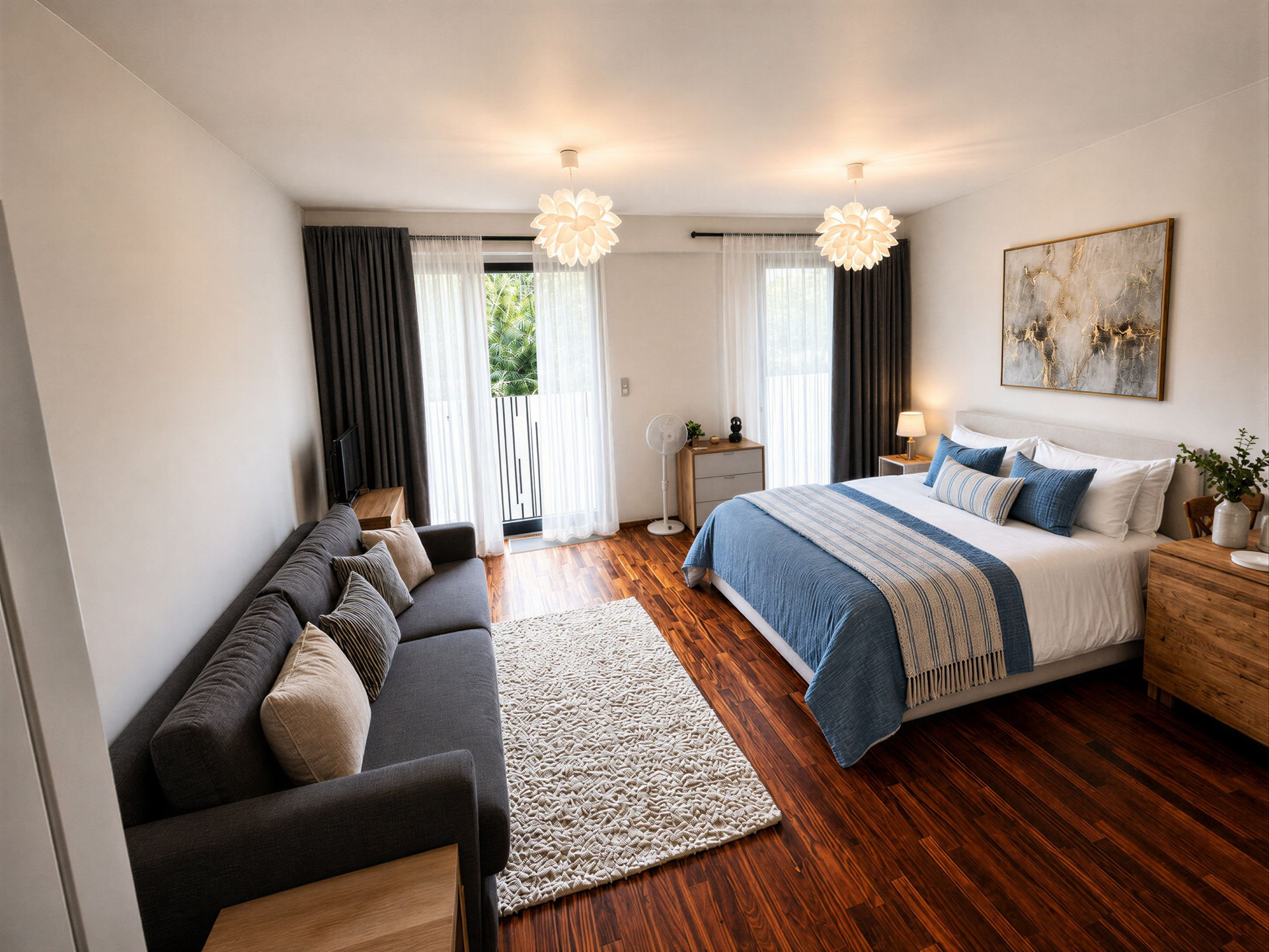 Studio bedroom with sofa and balcony