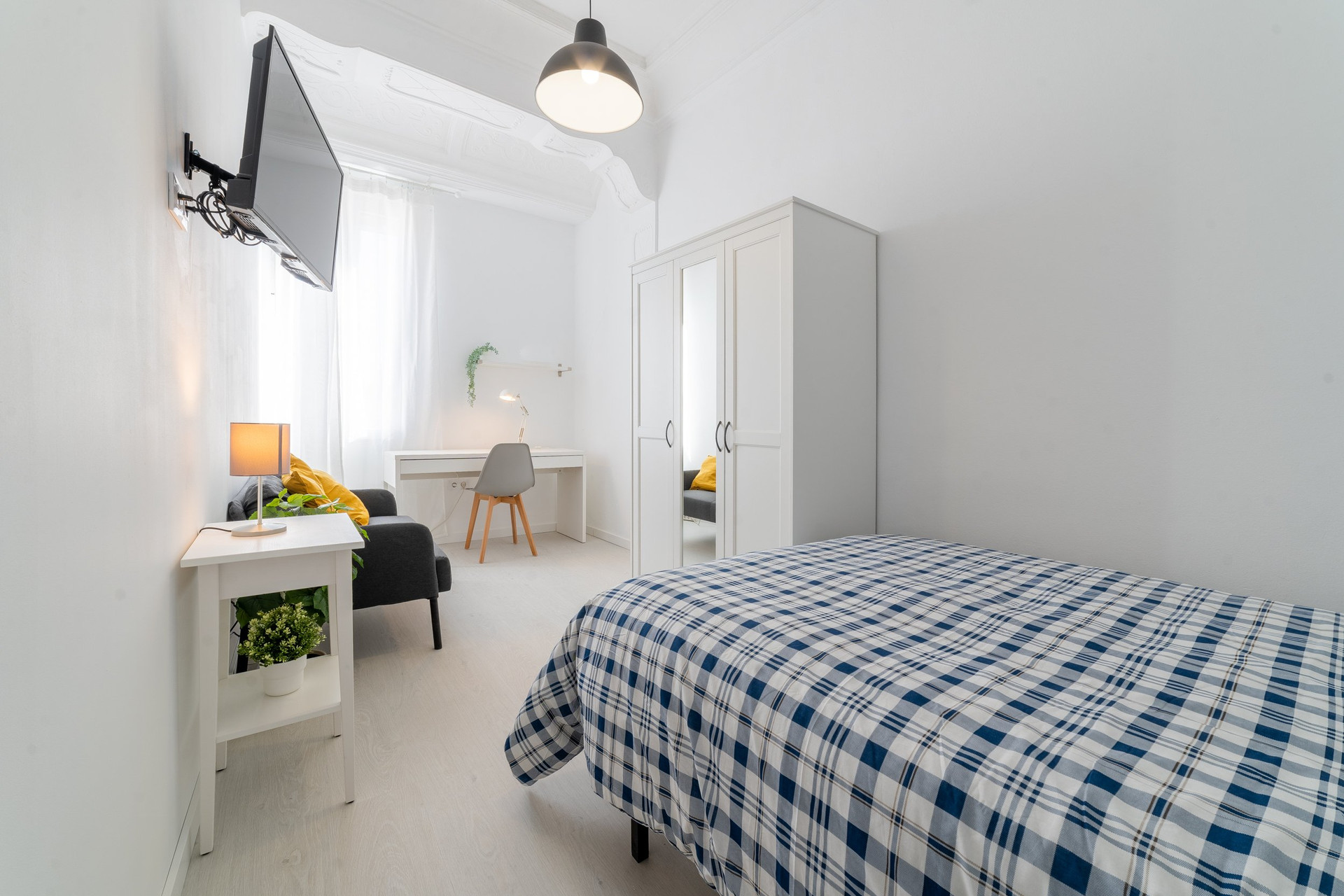 Bedroom overview with desk and wardrobe