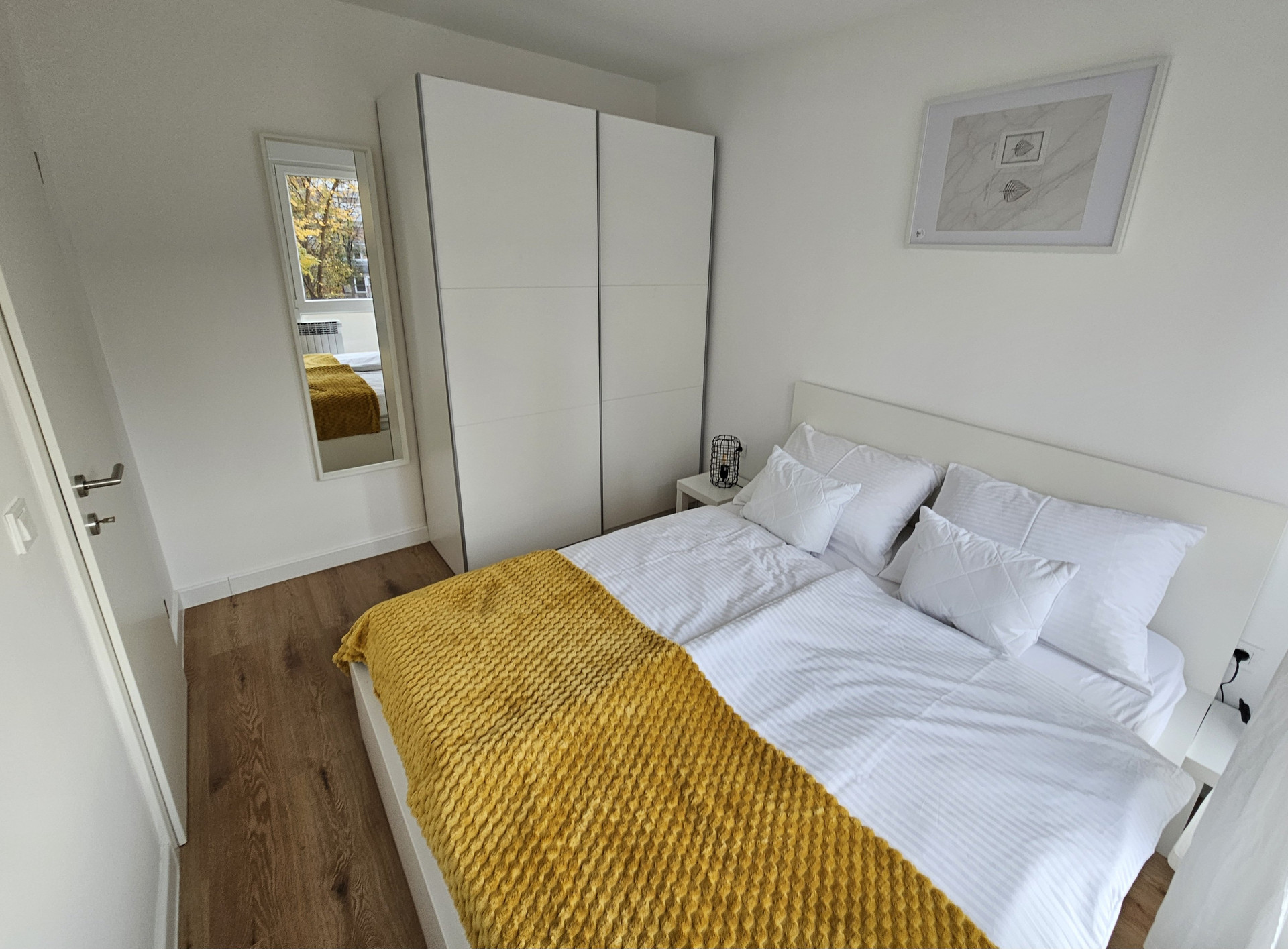Bright bedroom with double bed
