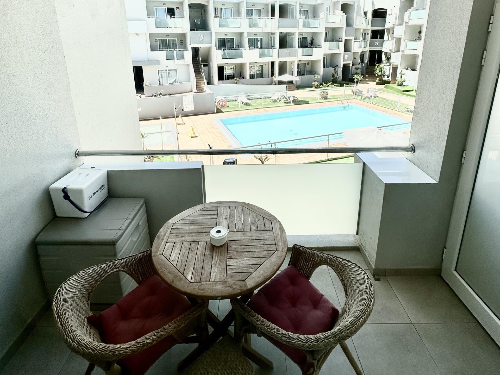 Balcony with pool view seating