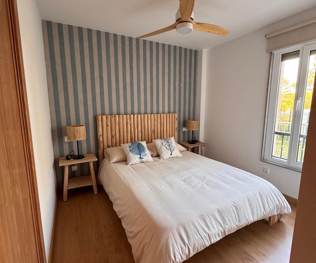 Bedroom with striped accent wall