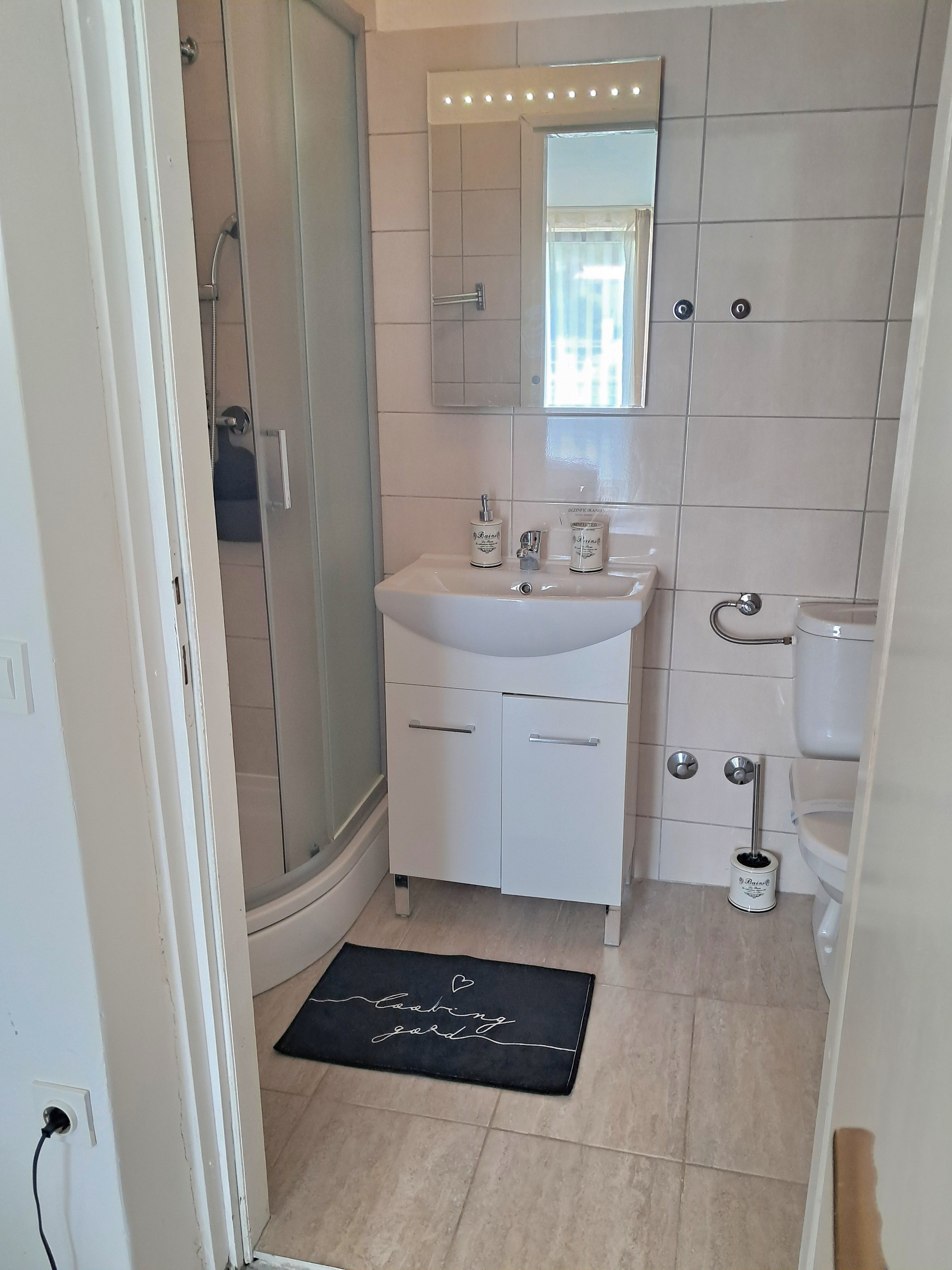 Bathroom with shower and sink