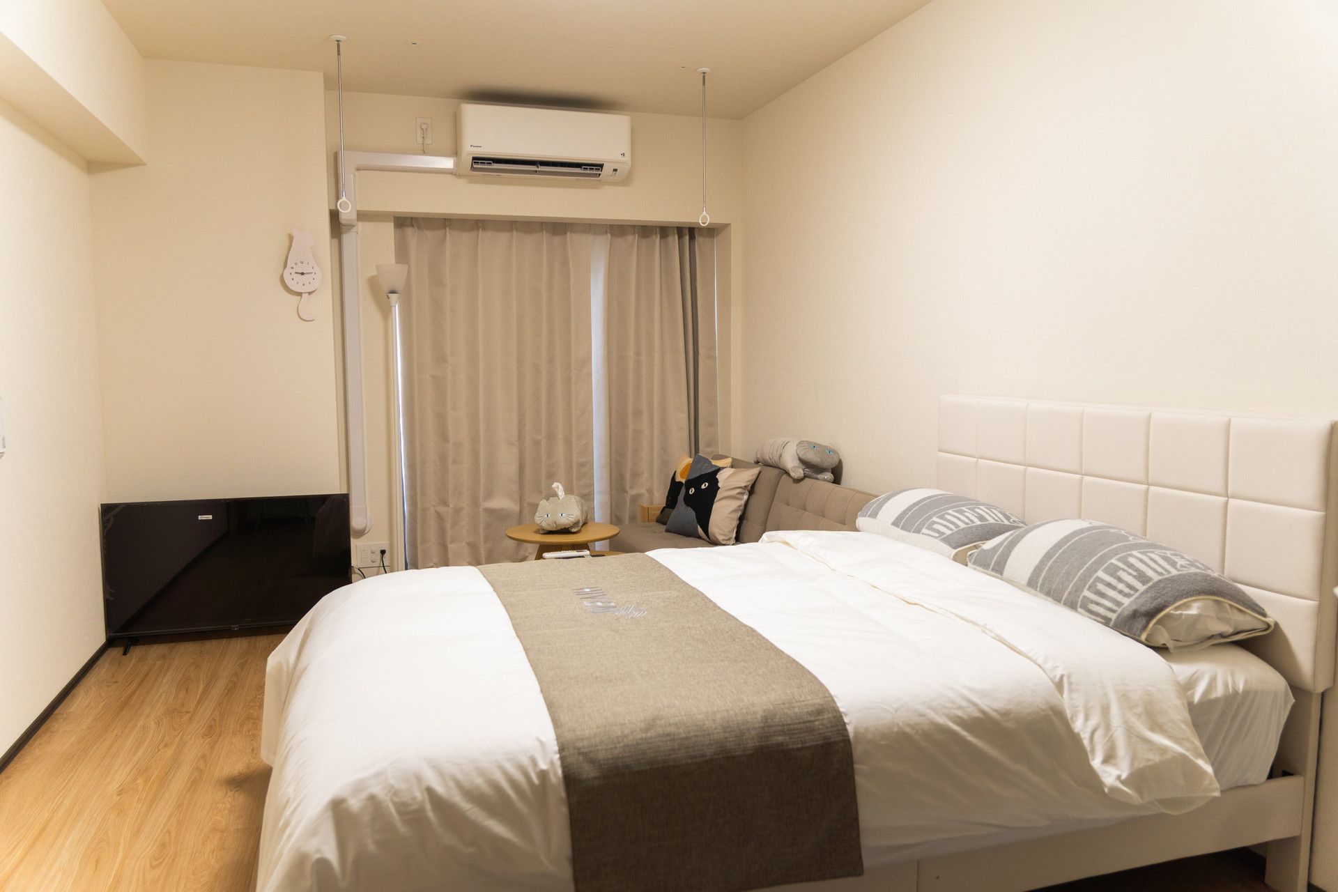 Bedroom with double bed and sofa