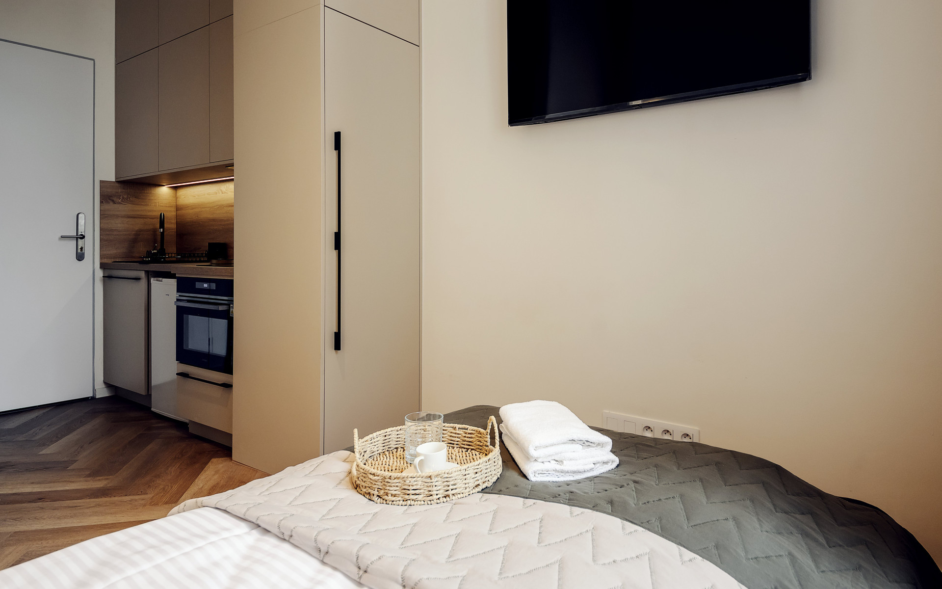 Bedroom with kitchenette and TV