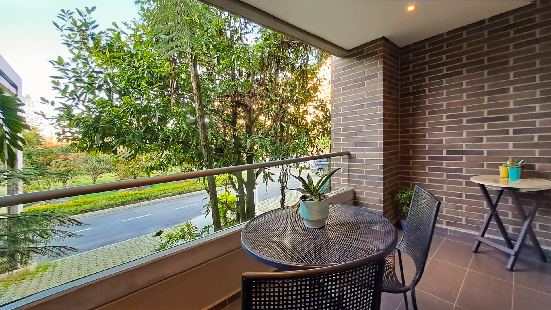 Private balcony with a pleasant green view, perfect for fresh air, coffee or a quiet break.