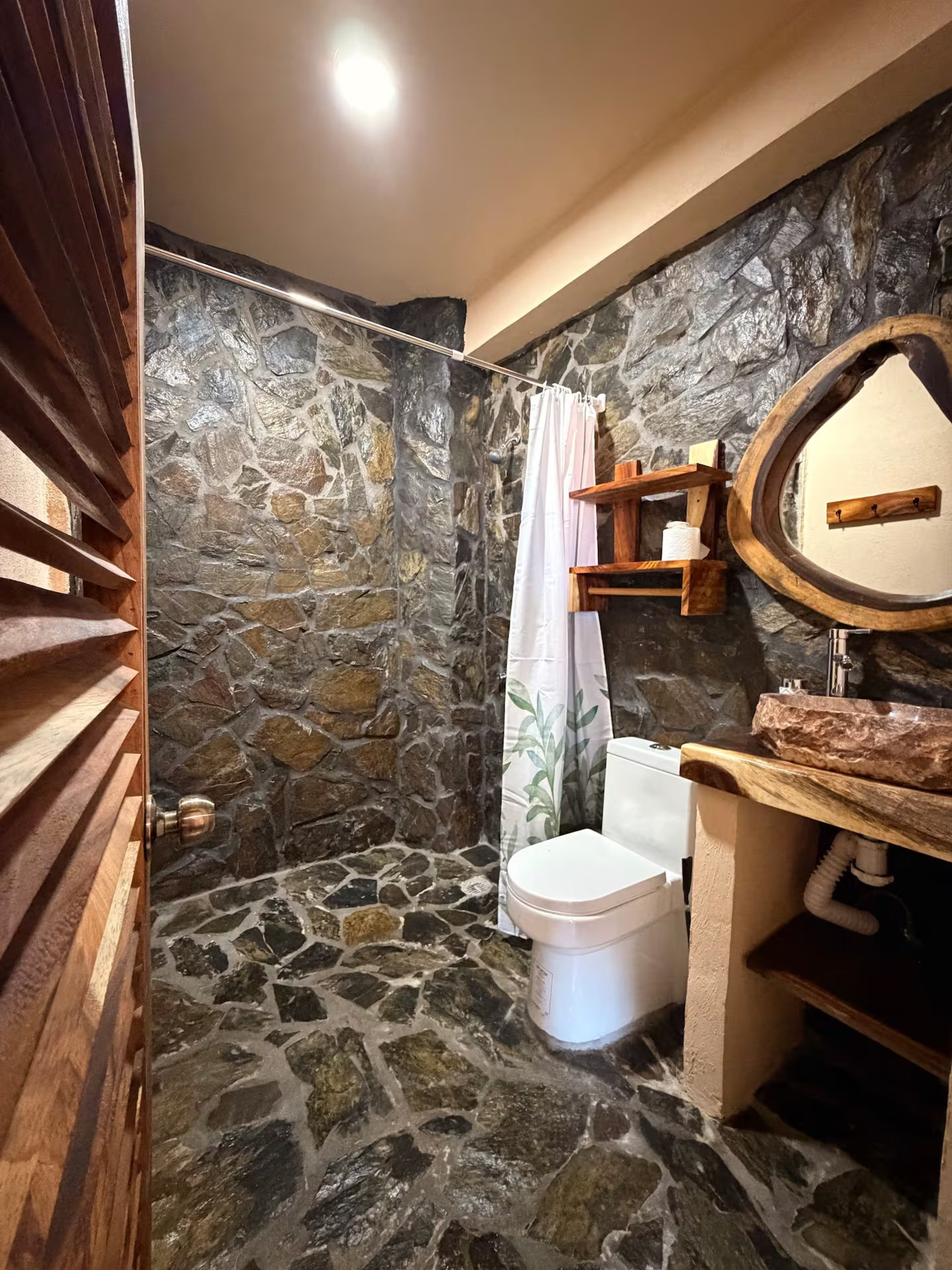 Stone bathroom with toilet sink