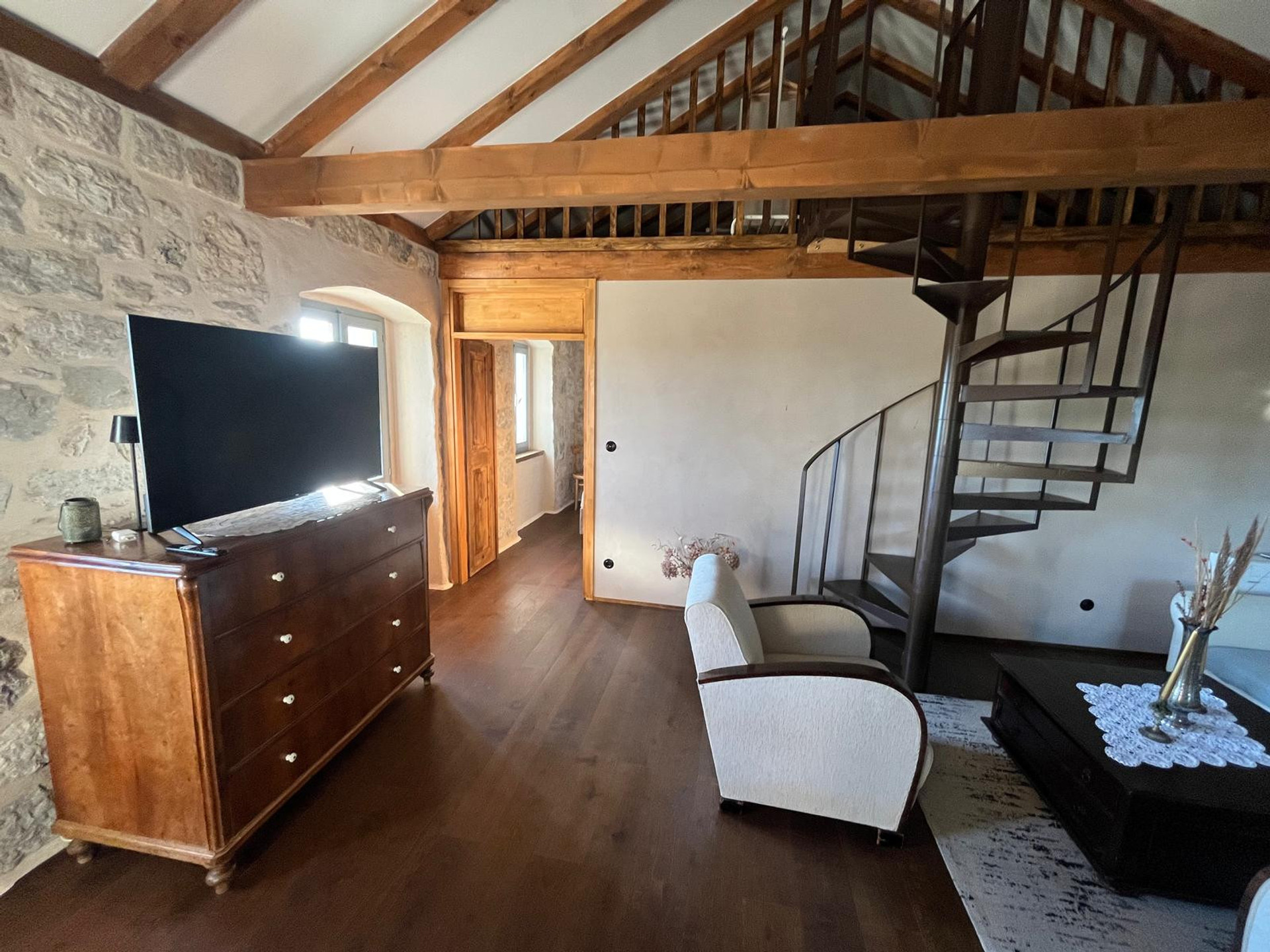 Loft living room with spiral stairs