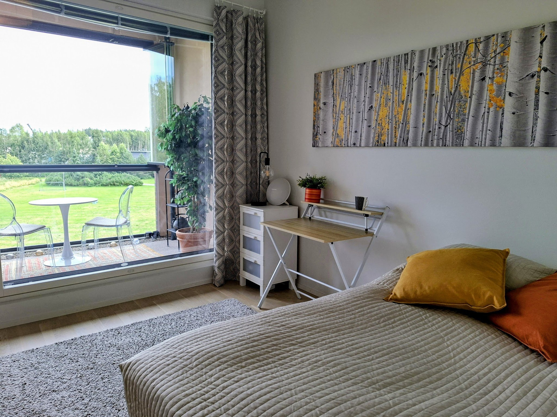 Bedroom with bed and balcony