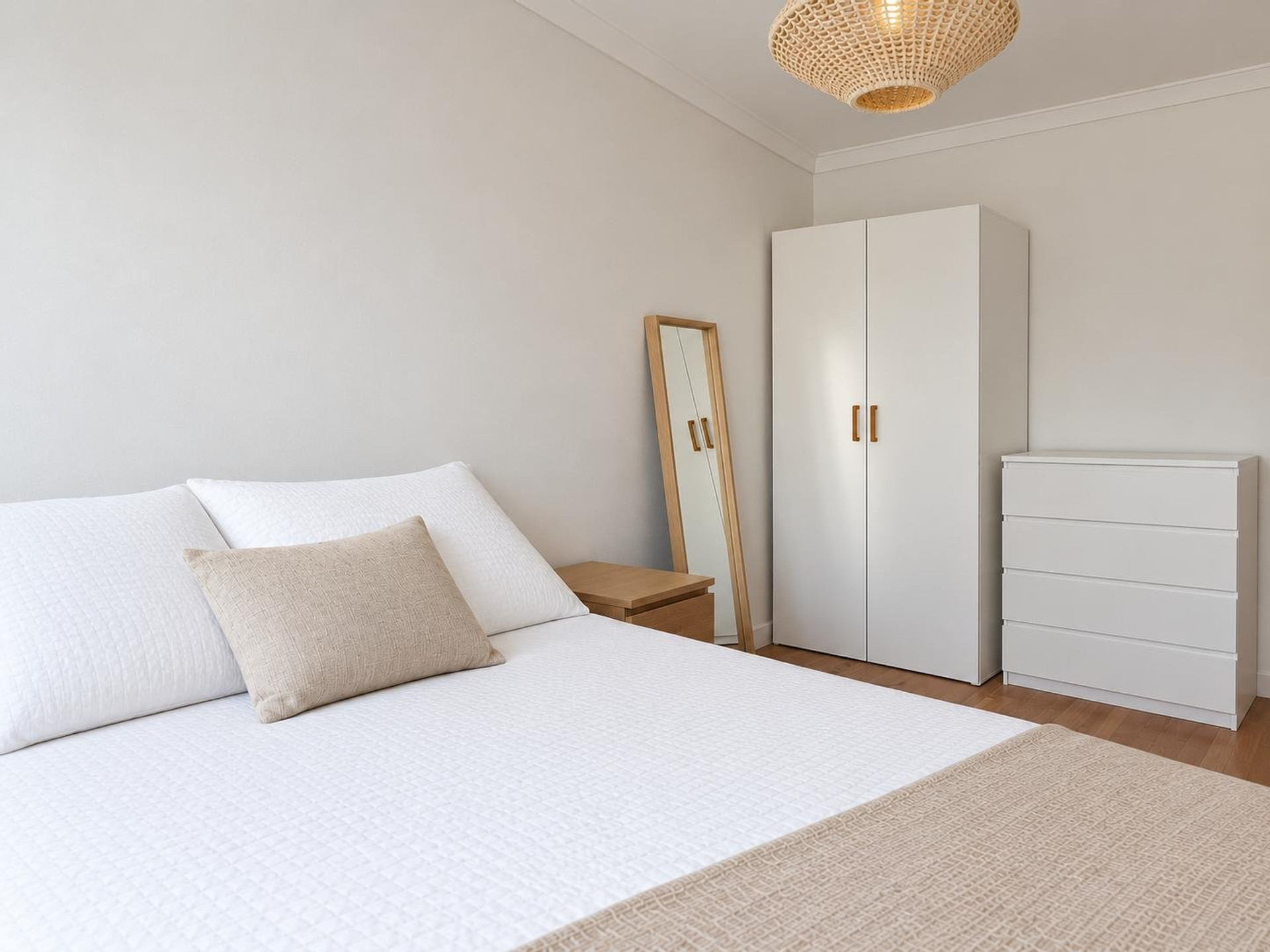 Bright bedroom with wardrobe and mirror