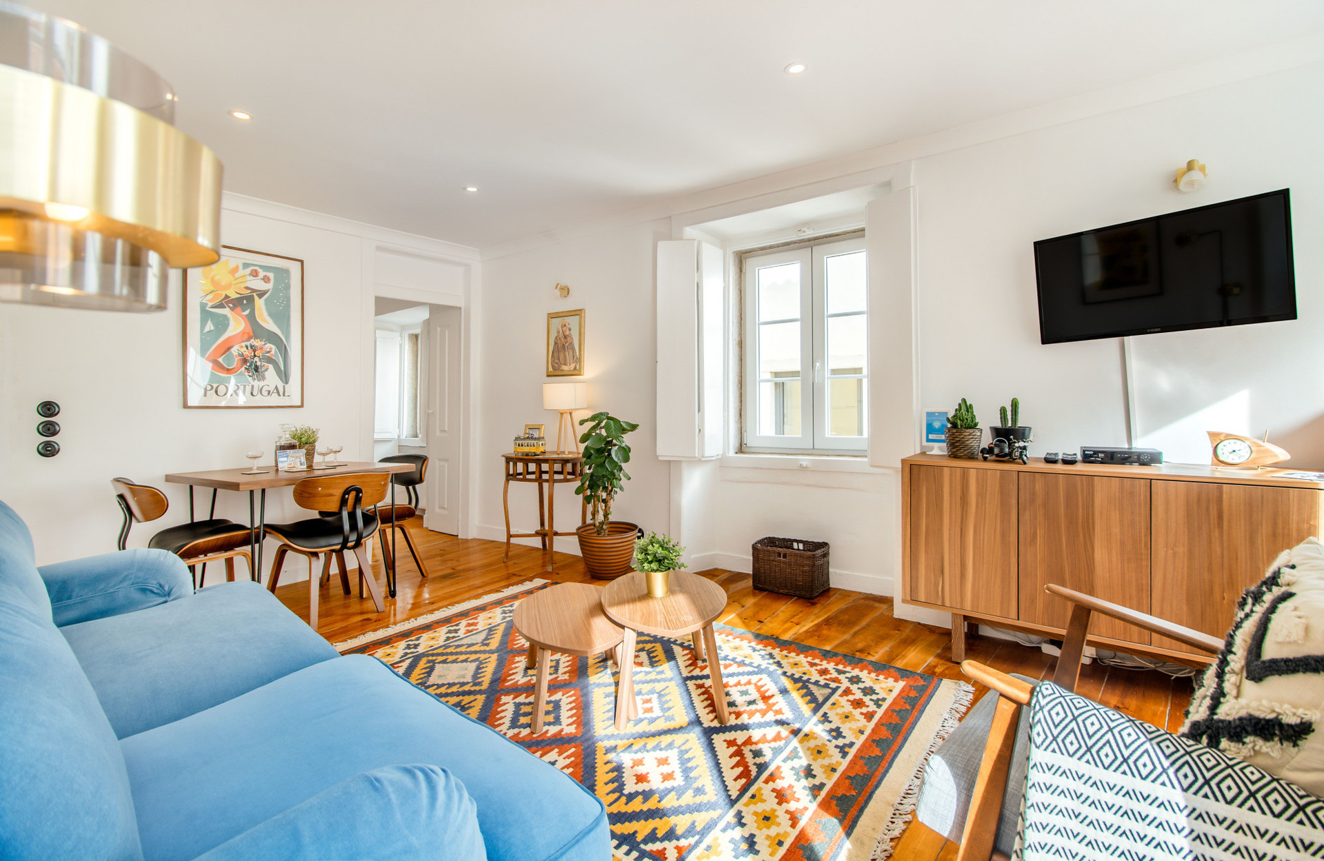 Living Room with Flat-Screen TV, tons of natural light, comfy furniture, air-conditioning and heating, beautiful art and details.