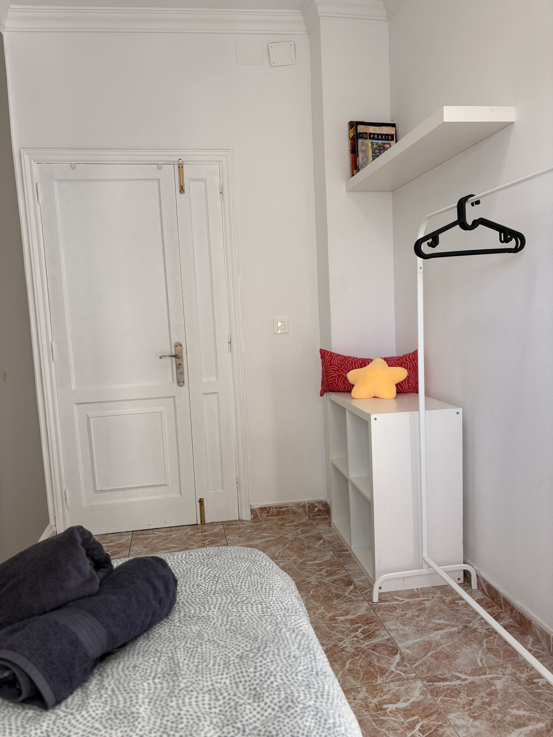 Bedroom storage shelf and clothes rack