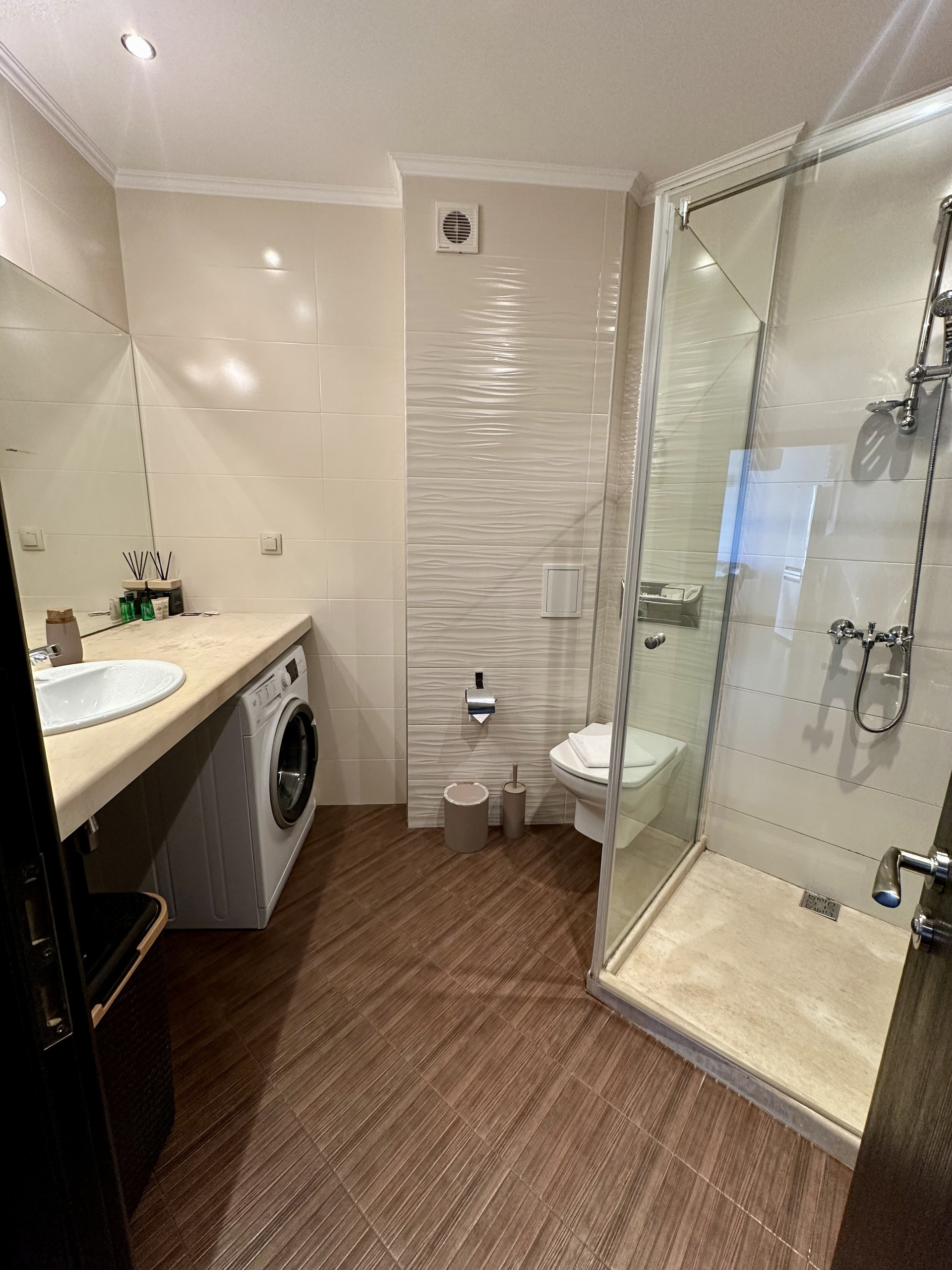 Bathroom with shower and washer