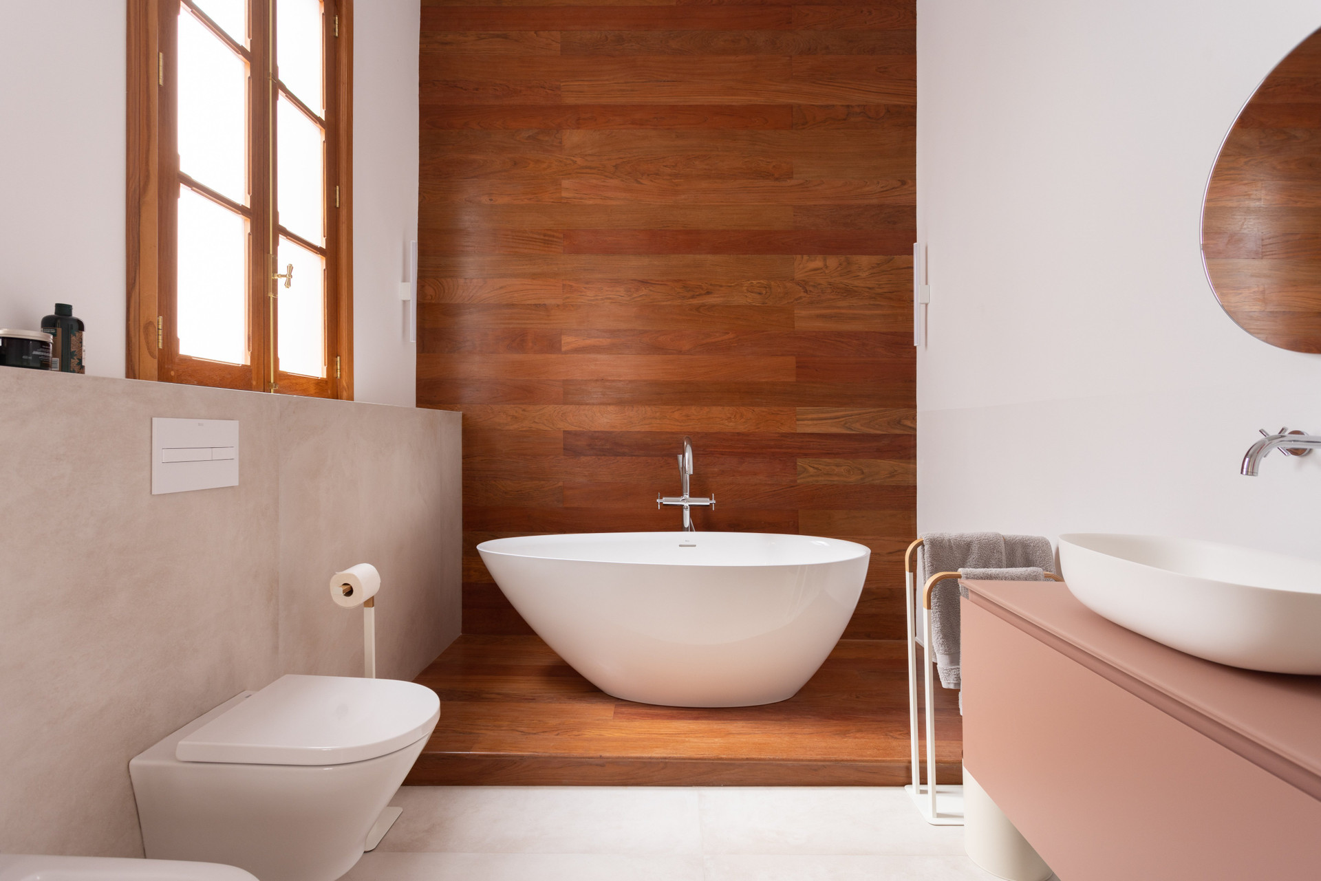 Freestanding tub with wood accent wall