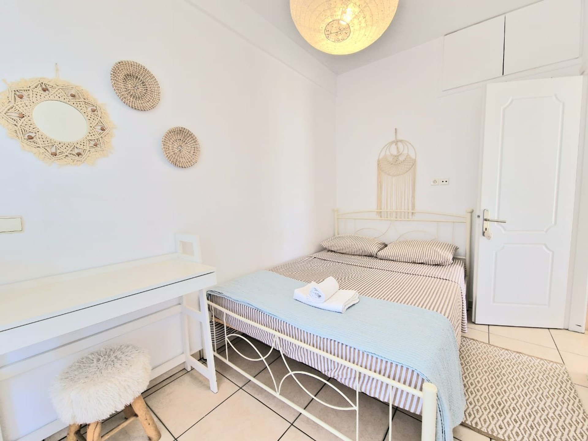 Cozy boho bedroom with wardrobe