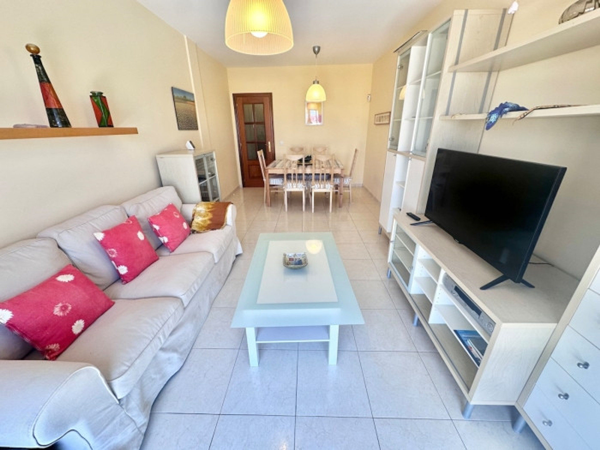 Living room with sofa and dining area
