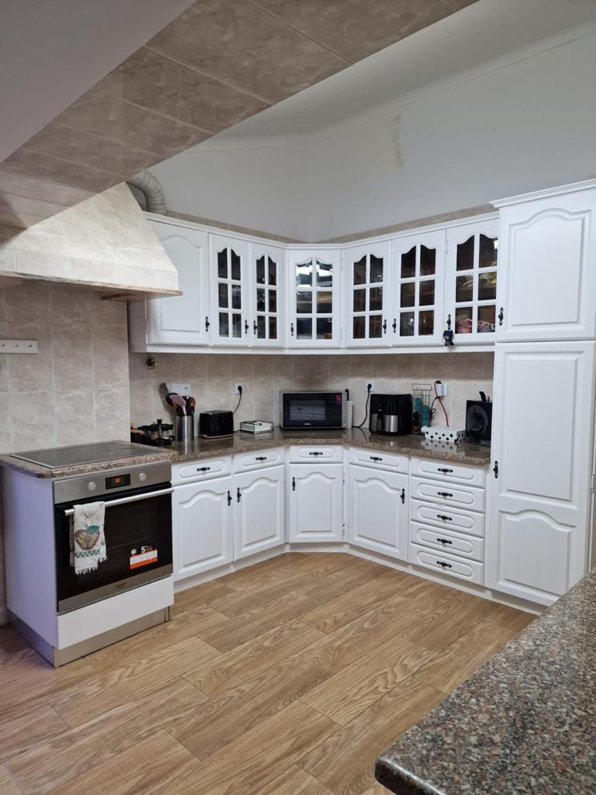 White kitchen with granite counters