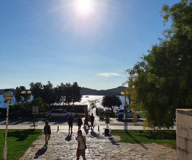 Sunny walkway toward the sea