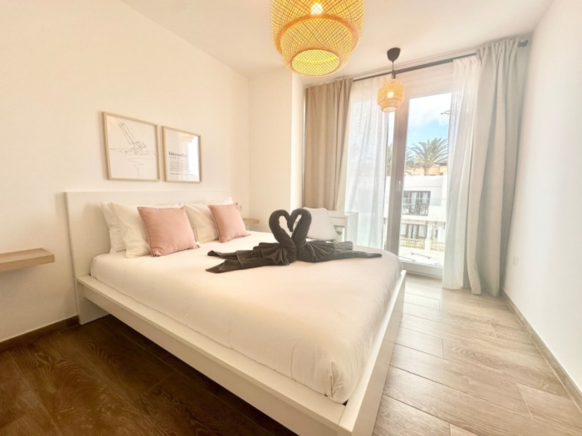 Bright master bedroom with balcony