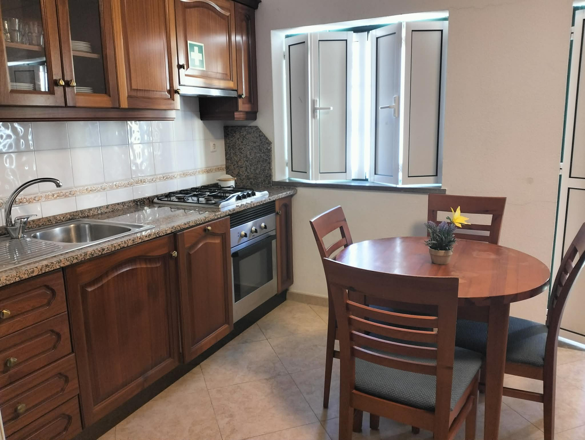 Kitchen with dining table and window