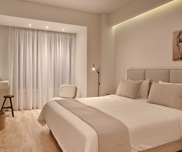 The second bedroom with a king size bed and a smart TV