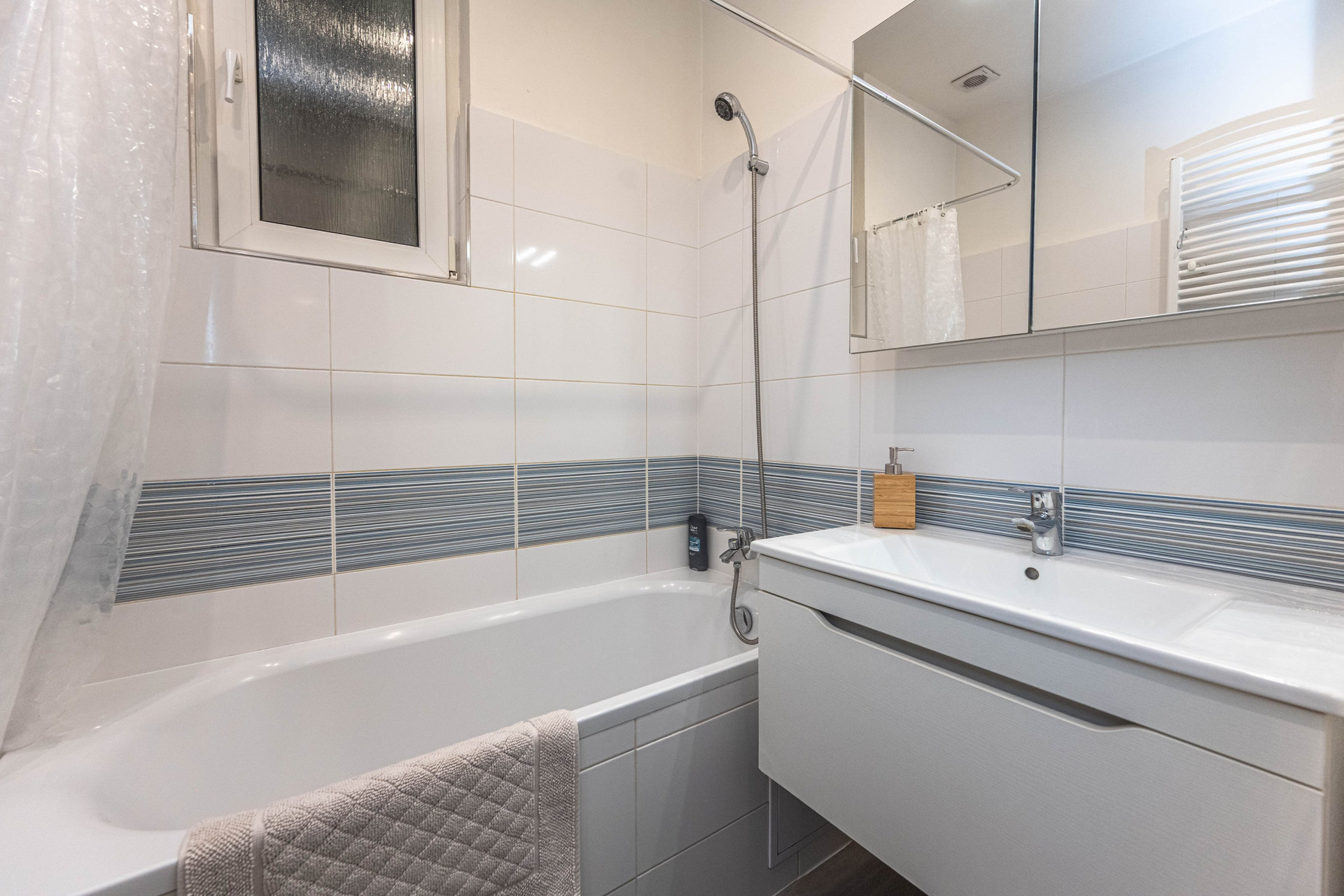 Bathroom with bathtub and sink
