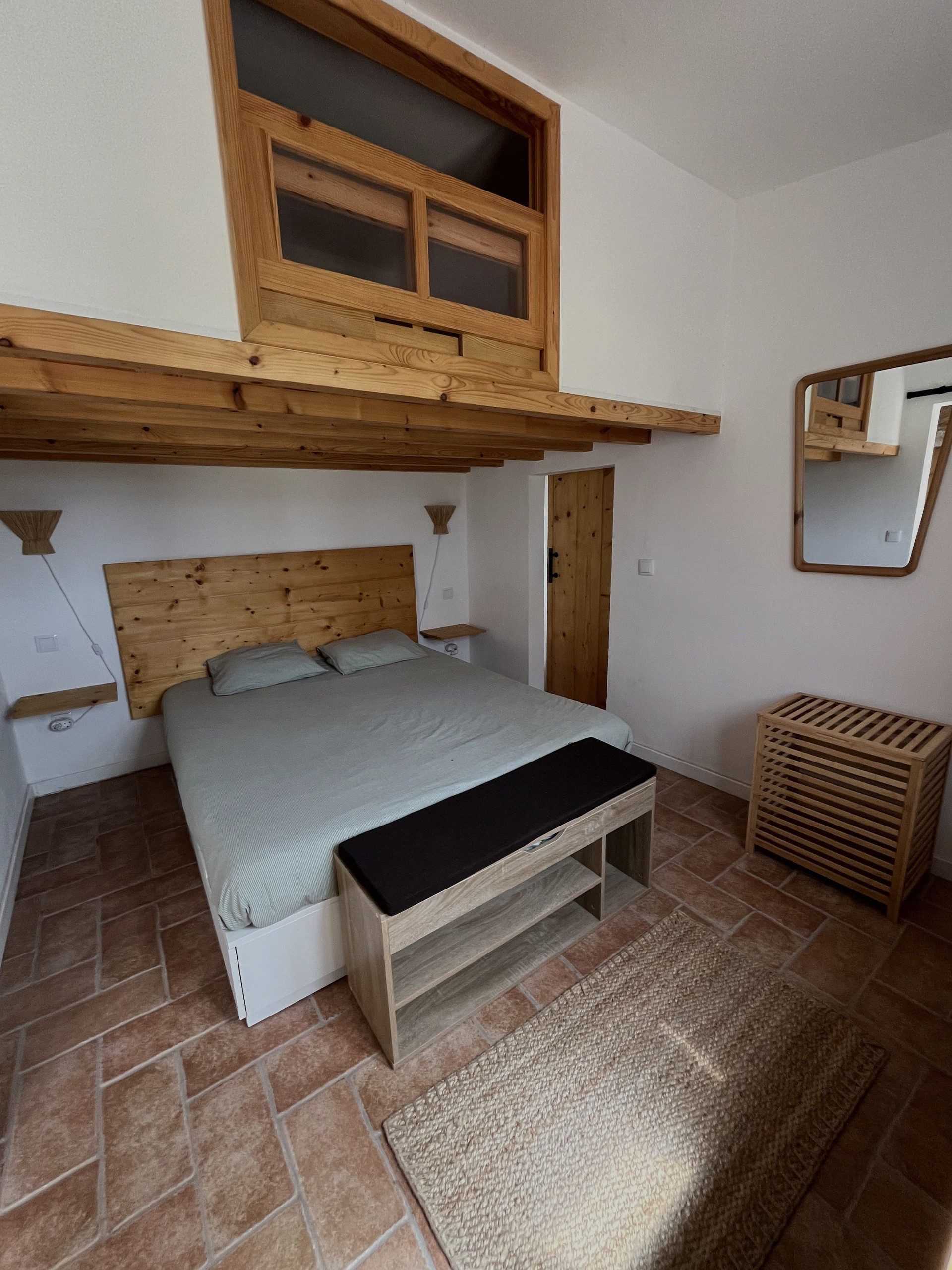 Bedroom with loft window above