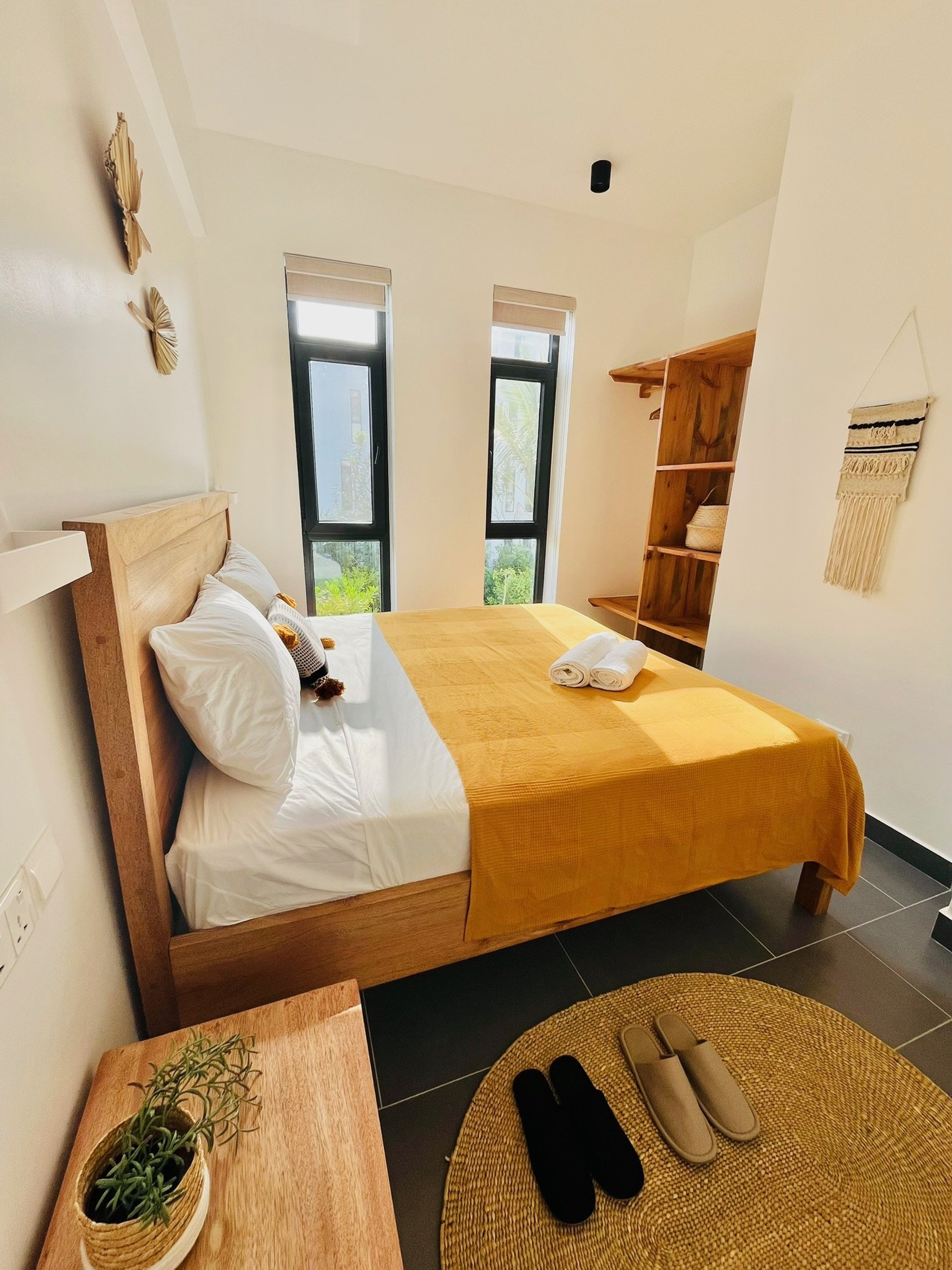 Bedroom with slippers and rug