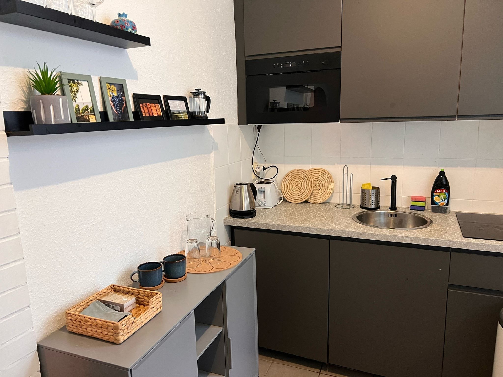 Modern dark kitchen with appliances