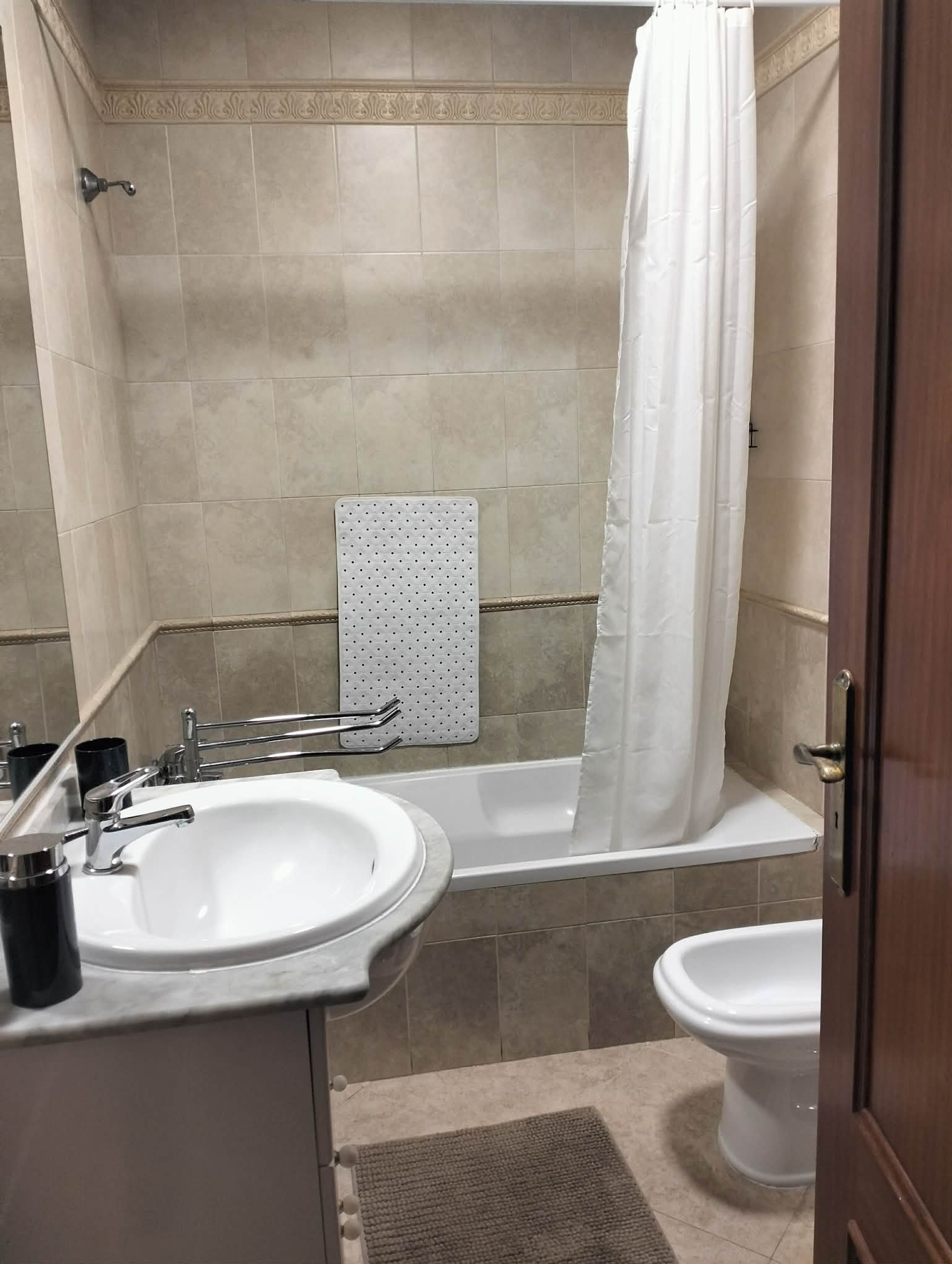 Bathroom with tub and sink