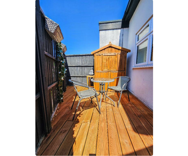 Sunny decking patio with seating