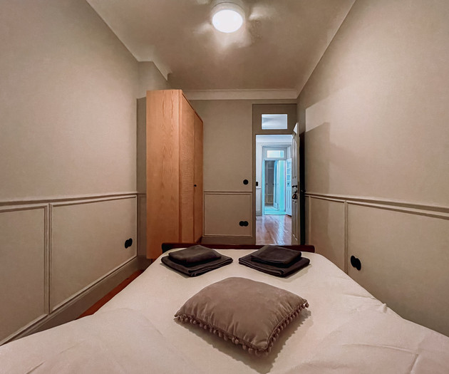 Bedroom with wardrobe and hallway view