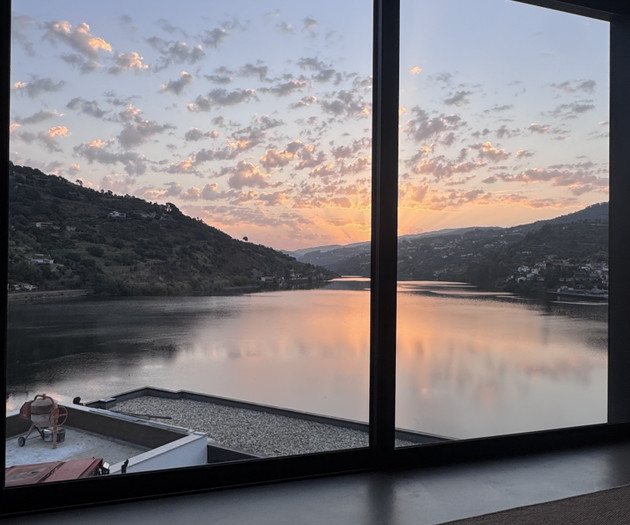 Sunset river view through window