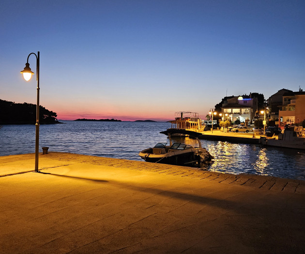 Harbor at dusk with lights