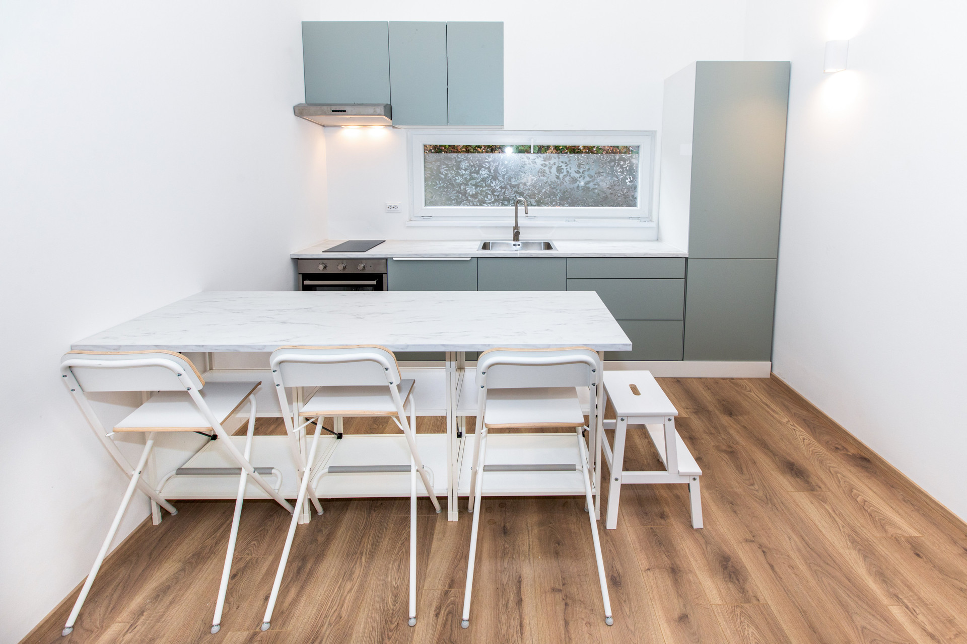 Kitchen dining table green cabinets