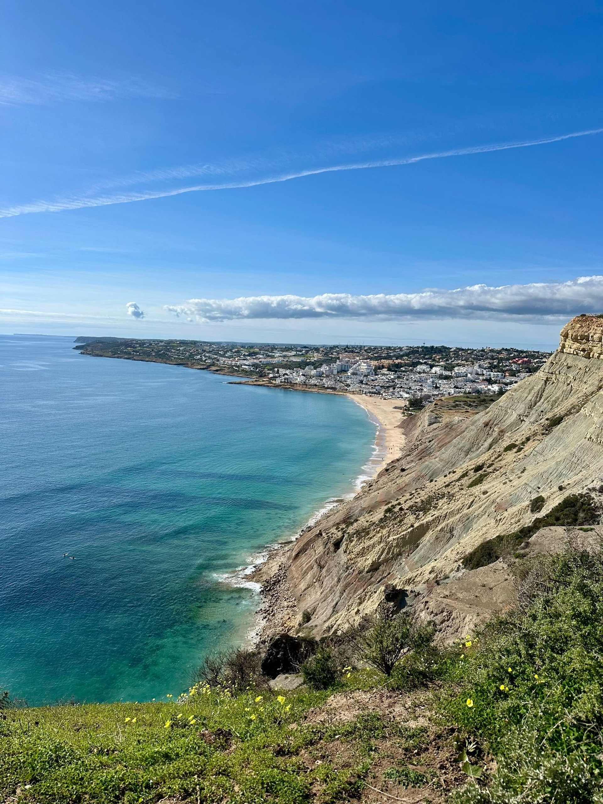 Coastal cliff view over beach town