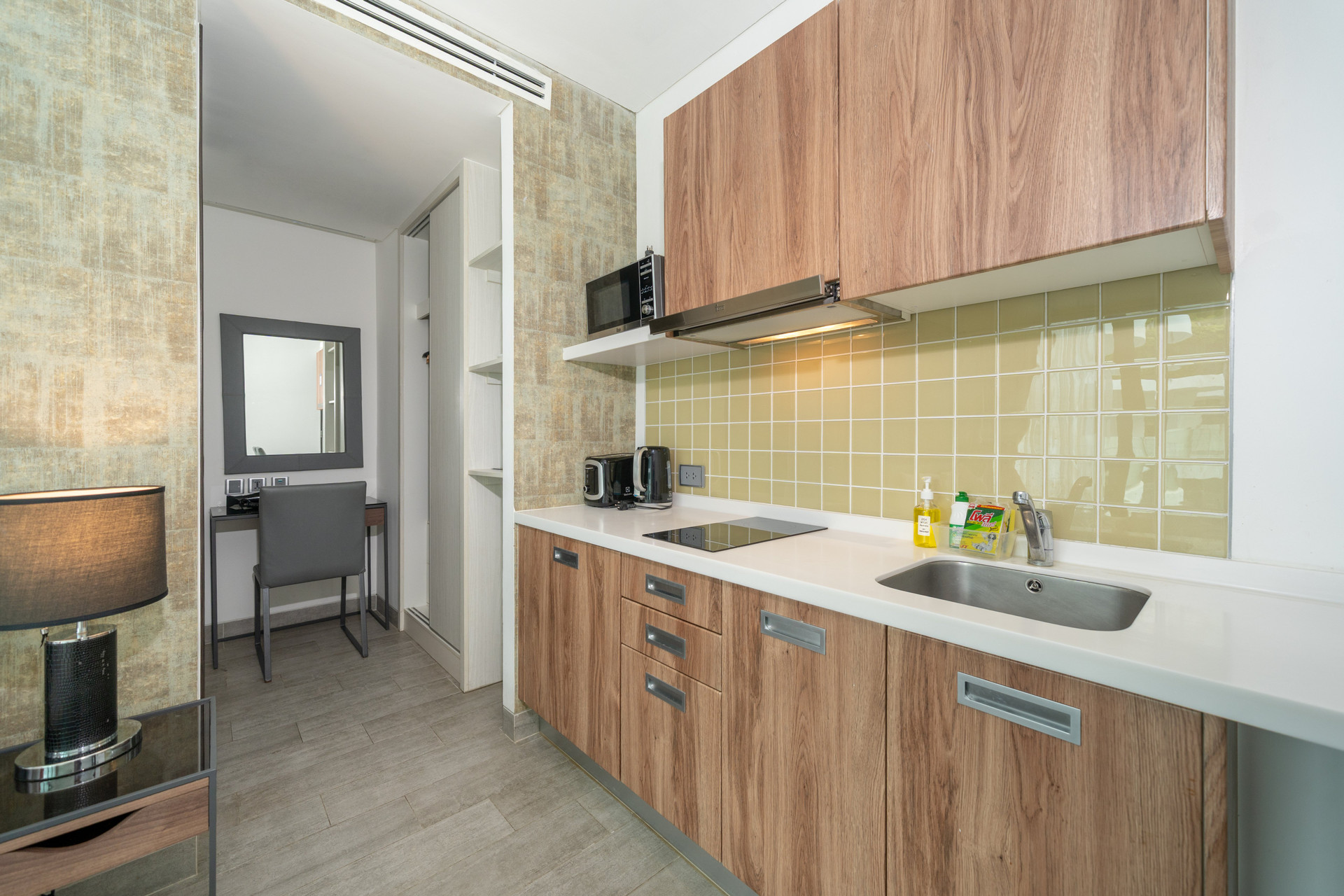Compact kitchen and dressing area